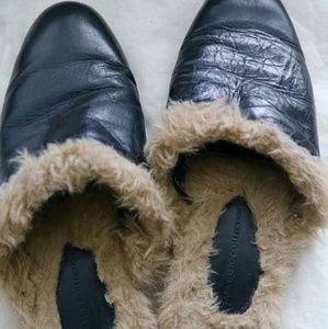 Black Zara leather slides.